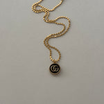 vintage mini gucci charm pendant necklace. black and gold.