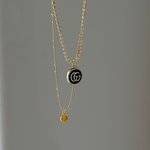 vintage mini gucci charm pendant necklace. black and gold.