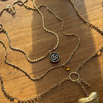 vintage mini gucci charm pendant necklace. black and gold.