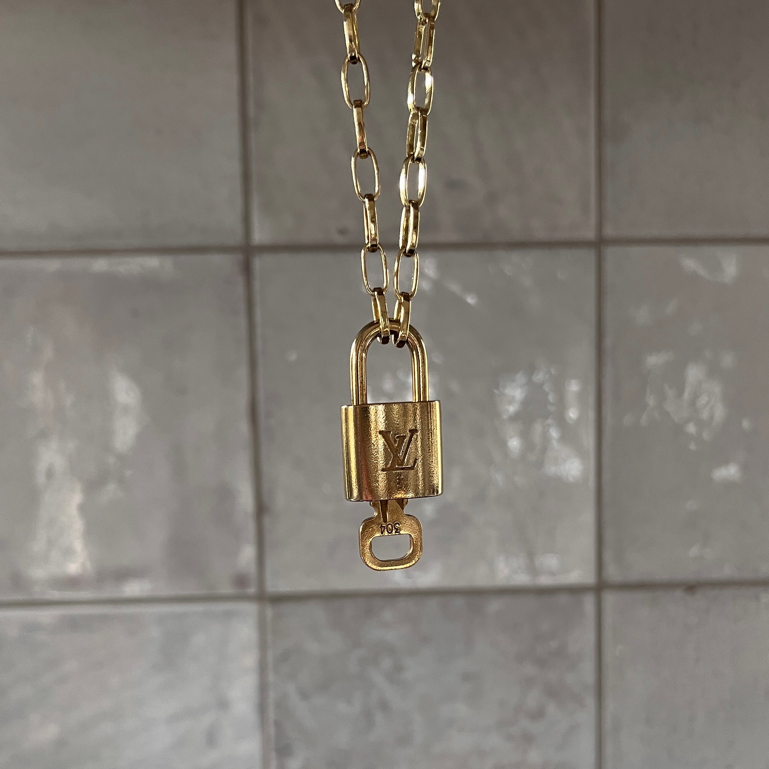 Vintage Louis Vuitton Lock Necklace – Re-Dunne