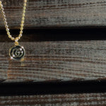 vintage mini gucci charm pendant necklace. black and gold.