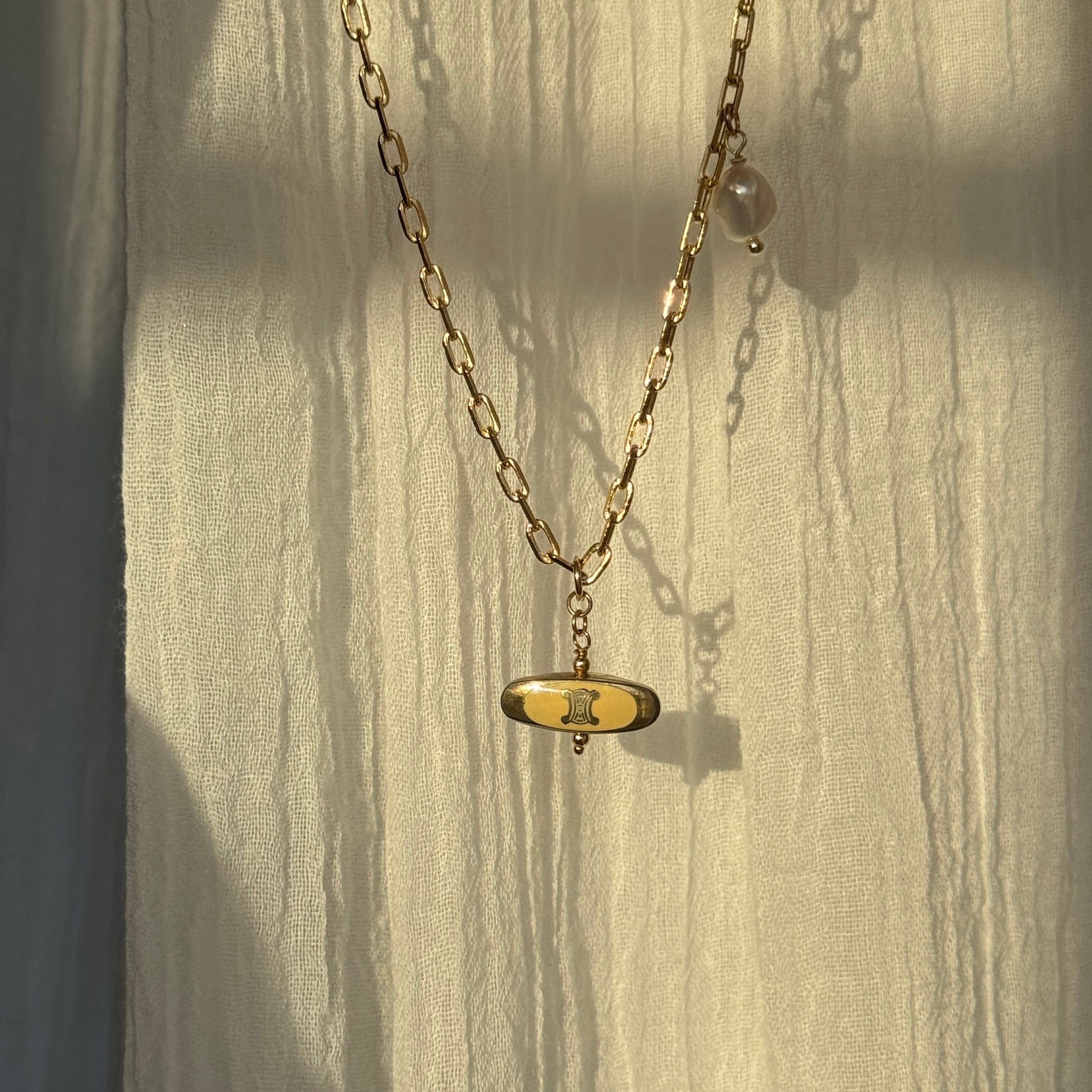 Vintage Cartier Authentic Gold Charm Necklace featuring keshi pearl detailing