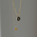 vintage mini gucci charm pendant necklace. black and gold. 