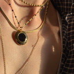 Vintage Givenchy necklace close up on neck