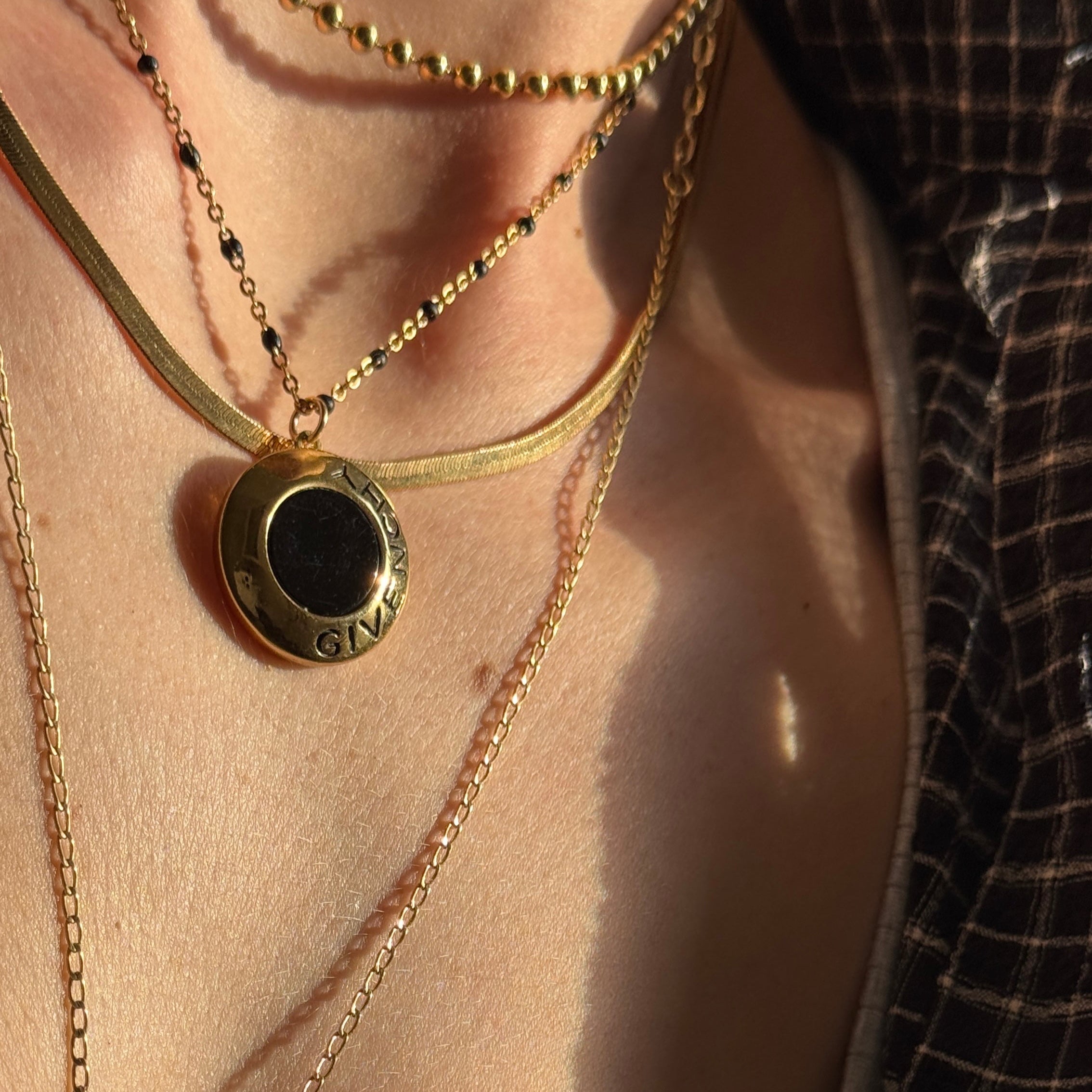 Vintage Givenchy necklace close up on neck