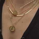 vintage ysl pendant necklace on neck layered